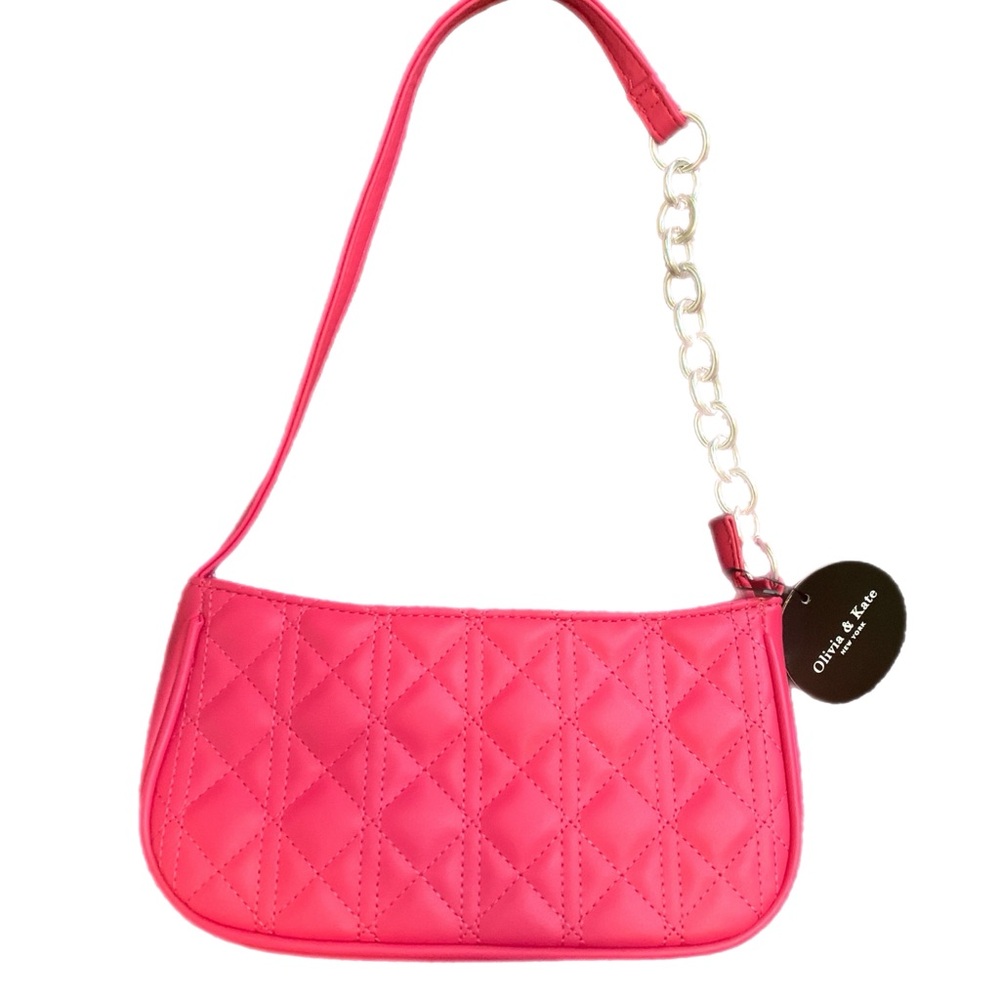Vibrant Pink Quilted Shoulder Bag with silver chain on partial strap.